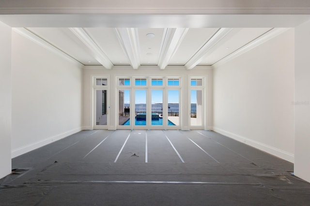 894 Hill Tide Ln, Boca Grande, FL 33921 - spare room featuring beamed ceiling, french doors, and baseboards