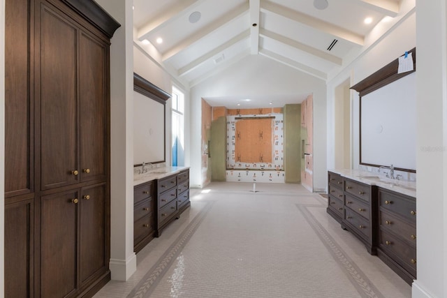 894 Hill Tide Ln, Boca Grande, FL 33921 - bathroom featuring two vanities and baseboards