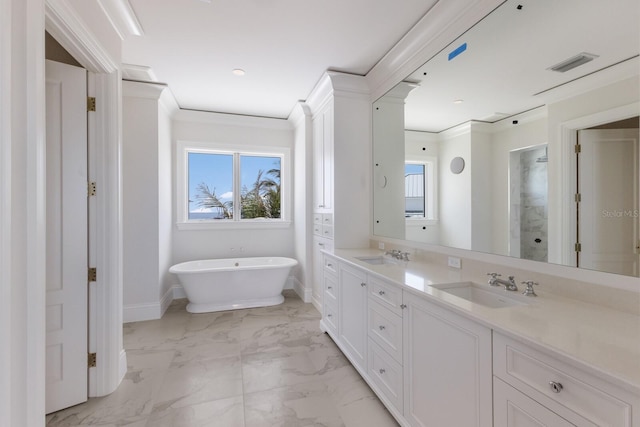 894 Hill Tide Ln, Boca Grande, FL 33921 - bathroom featuring double vanity, plenty of natural light, a walk in shower, a soaking tub, and ornamental molding