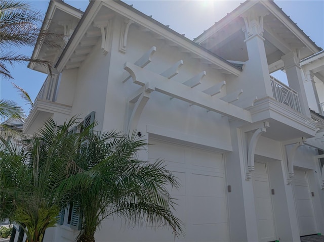 894 Hill Tide Ln, Boca Grande, FL 33921 - view of side of property with a balcony and a garage