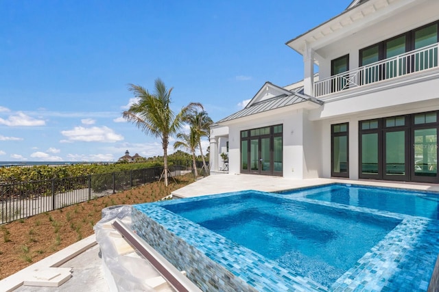 894 Hill Tide Ln, Boca Grande, FL 33921 - view of pool featuring french doors, a patio area, and a pool with connected hot tub