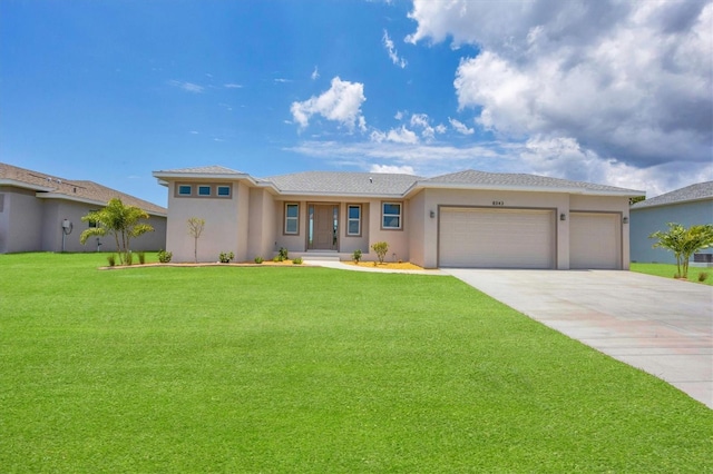 view of front of house with a garage and a front lawn