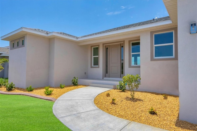 entrance to property with a yard