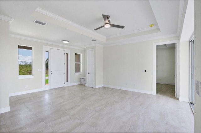 8343 Olsen St, Port Charlotte, FL 33981 - tiled empty room featuring ceiling fan, a raised ceiling, and crown molding