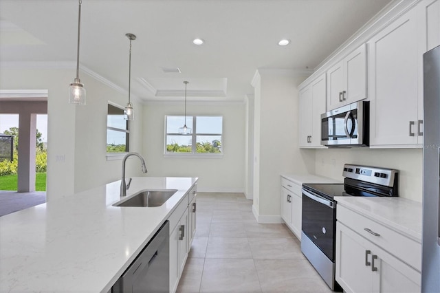 8343 Olsen St, Port Charlotte, FL 33981 - kitchen featuring stainless steel appliances, light tile flooring, hanging light fixtures, sink, and white cabinetry