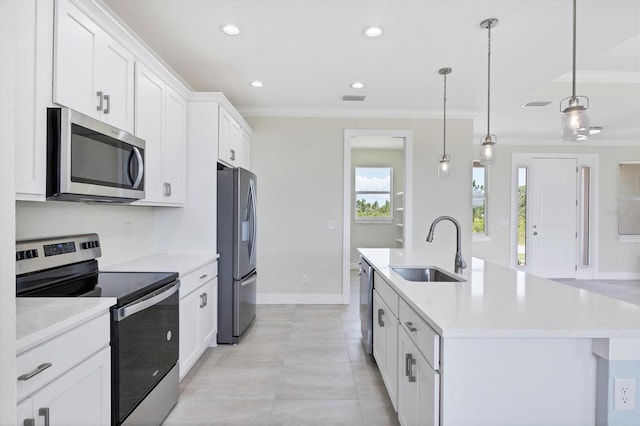 8343 Olsen St, Port Charlotte, FL 33981 - kitchen with decorative light fixtures, white cabinetry, an island with sink, appliances with stainless steel finishes, and sink