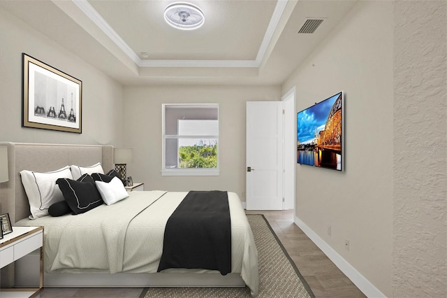 8343 Olsen St, Port Charlotte, FL 33981 - bedroom featuring hardwood / wood-style floors and a raised ceiling