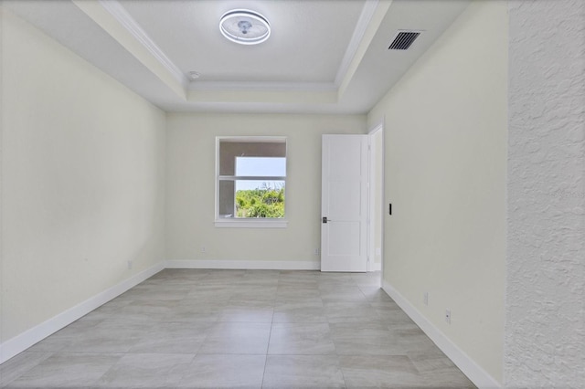 8343 Olsen St, Port Charlotte, FL 33981 - tiled spare room featuring a tray ceiling and crown molding