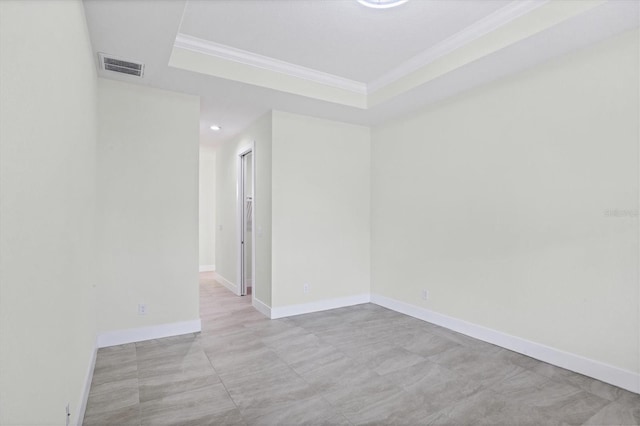 8343 Olsen St, Port Charlotte, FL 33981 - tiled empty room featuring a raised ceiling
