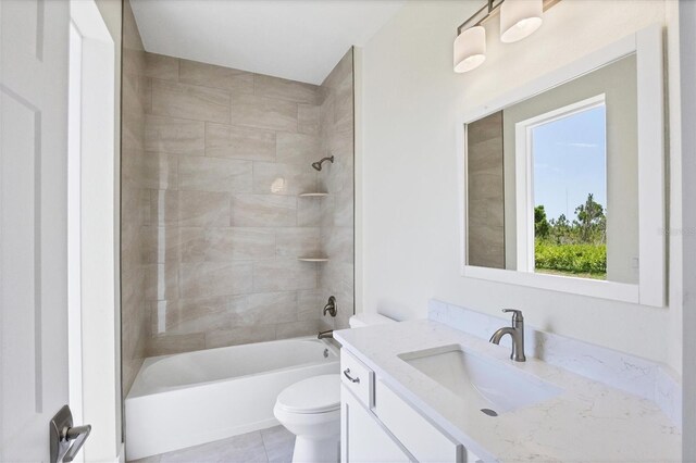 8343 Olsen St, Port Charlotte, FL 33981 - full bathroom with tile floors, vanity, toilet, and tiled shower / bath combo