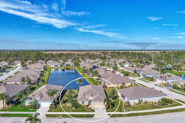 aerial view featuring a residential view and a water view