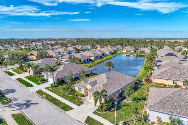 bird's eye view with a residential view and a water view