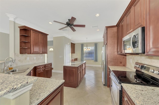 kitchen featuring visible vents, a sink, ornamental molding, appliances with stainless steel finishes, and open shelves