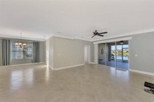 spare room featuring a healthy amount of sunlight and ornamental molding