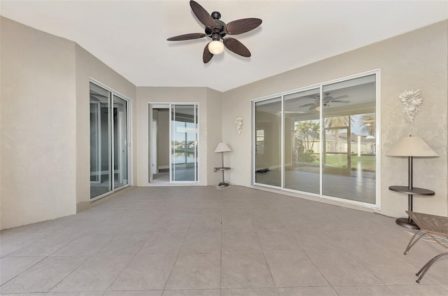 exterior space featuring ceiling fan