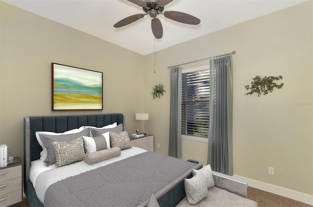 carpeted bedroom featuring a ceiling fan and baseboards