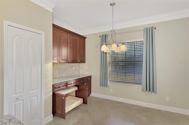 kitchen with light stone counters, baseboards, ornamental molding, a notable chandelier, and backsplash