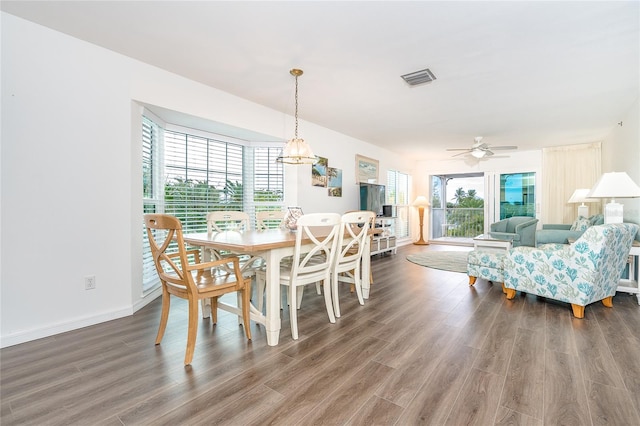 dining room featuring dark hardwood / wood-style floors and ceiling fan