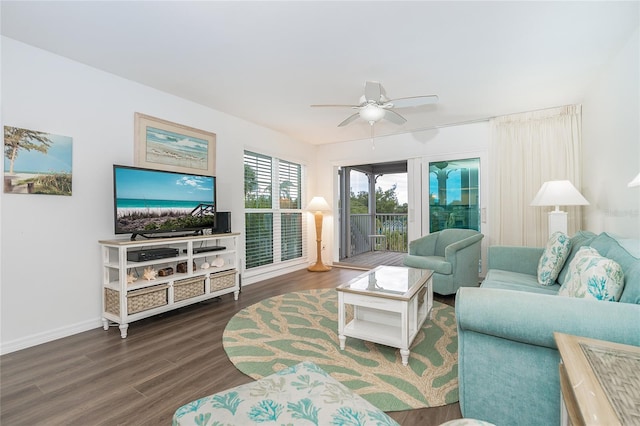 living room featuring dark hardwood / wood-style floors and ceiling fan