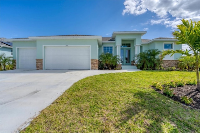 view of front of property with a front yard and a garage