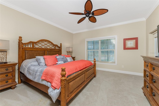 carpeted bedroom with ornamental molding and ceiling fan