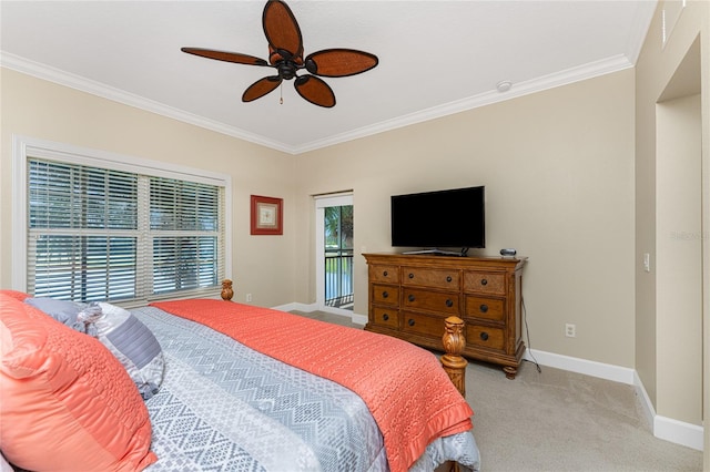 carpeted bedroom featuring ornamental molding and ceiling fan