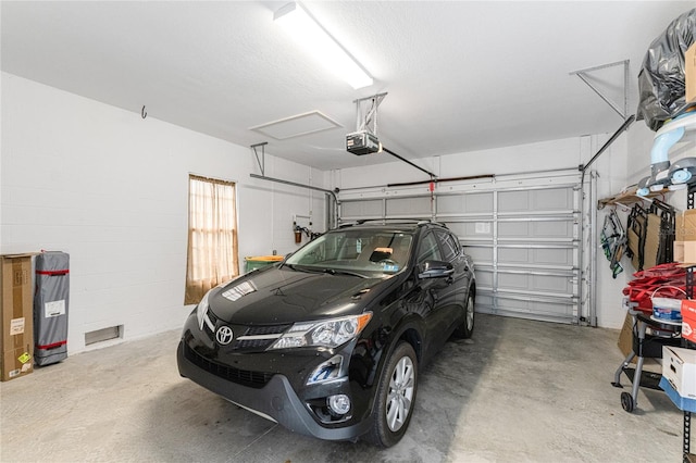 garage featuring a garage door opener