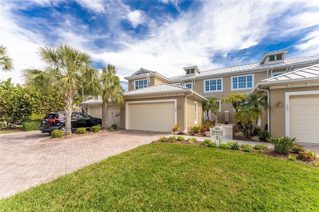 view of front of house featuring a front yard and a garage