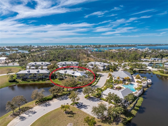 birds eye view of property with a water view