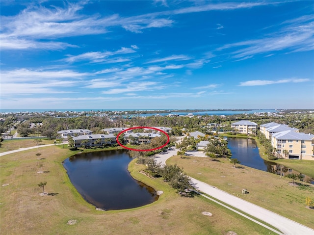 bird's eye view with a water view