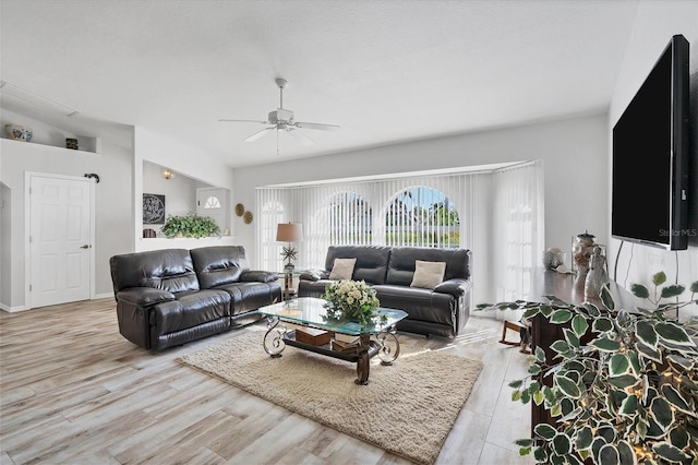 living room with light hardwood / wood-style floors and ceiling fan