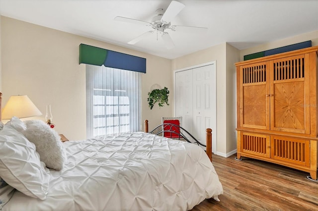 bedroom with a closet, ceiling fan, and dark wood-type flooring