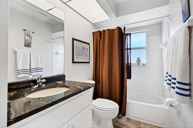 full bathroom featuring toilet, wood-type flooring, shower / tub combo with curtain, and large vanity