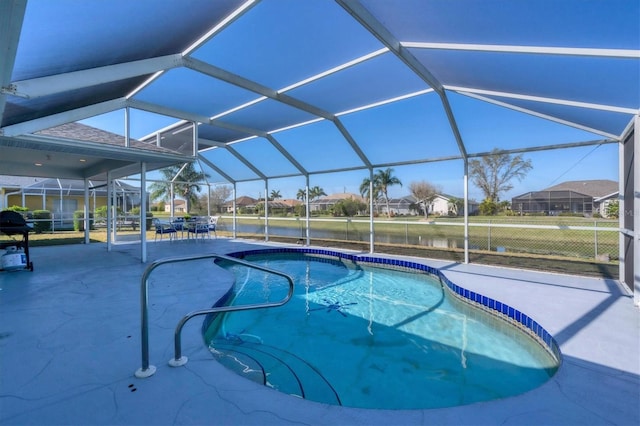 view of pool featuring glass enclosure and a patio