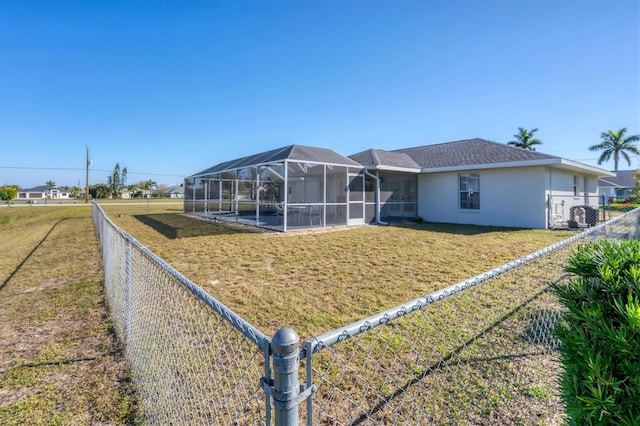 view of front of property with a front yard and a lanai