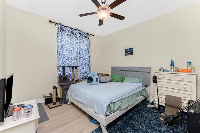 bedroom featuring ceiling fan and light hardwood / wood-style flooring