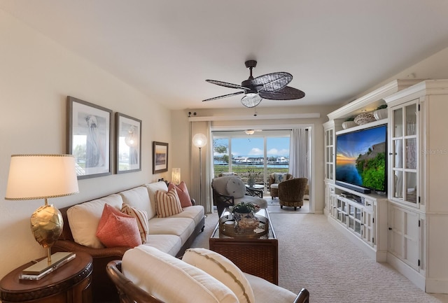 living room with light carpet and ceiling fan