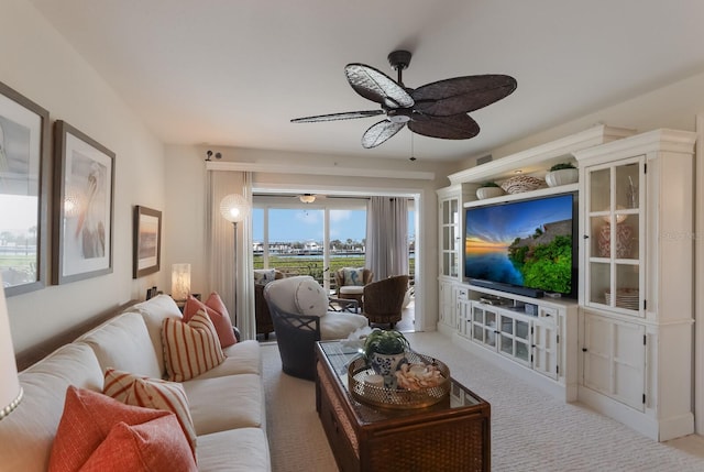 living room with light carpet and ceiling fan