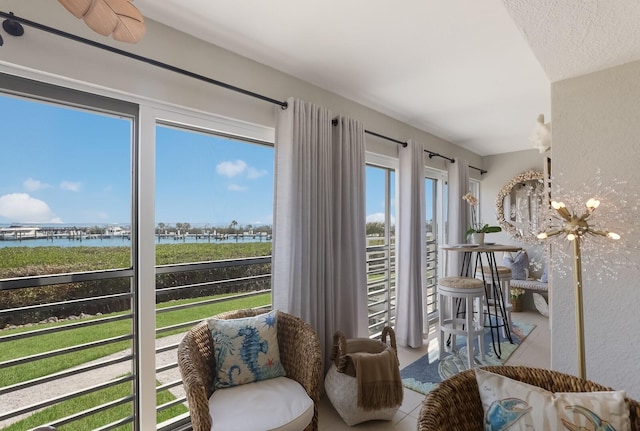 interior space featuring a chandelier and a water view