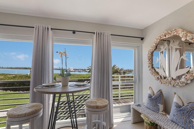 doorway to outside featuring a water view