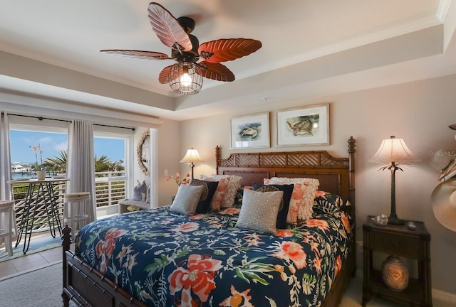 bedroom with a raised ceiling, access to outside, crown molding, and ceiling fan