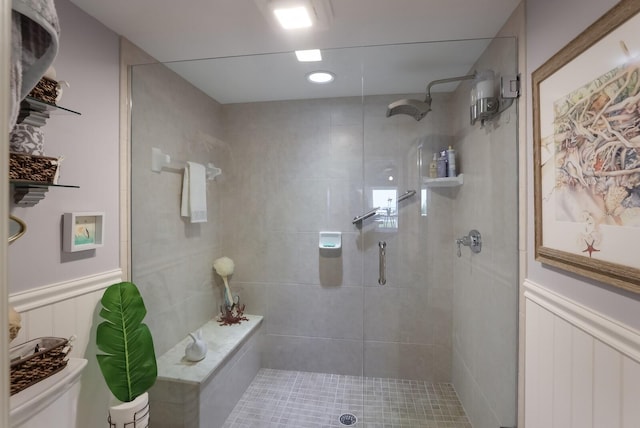 bathroom with a shower with door and toilet