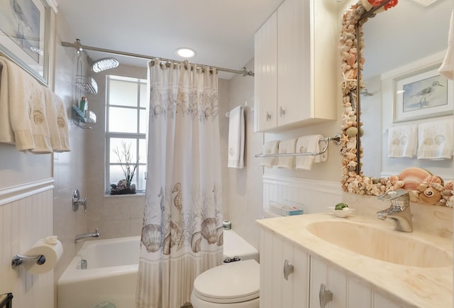 full bathroom with toilet, vanity, and shower / bath combination with curtain