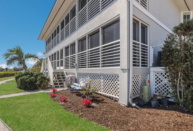 view of property exterior featuring a lawn