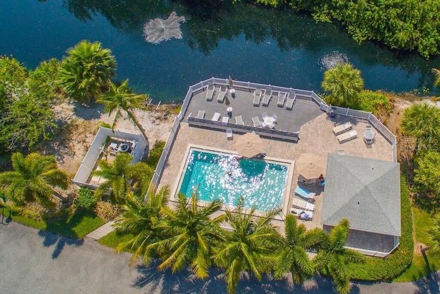 birds eye view of property with a water view