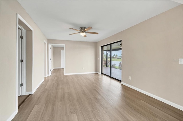 unfurnished room featuring light wood-style floors, ceiling fan, and baseboards