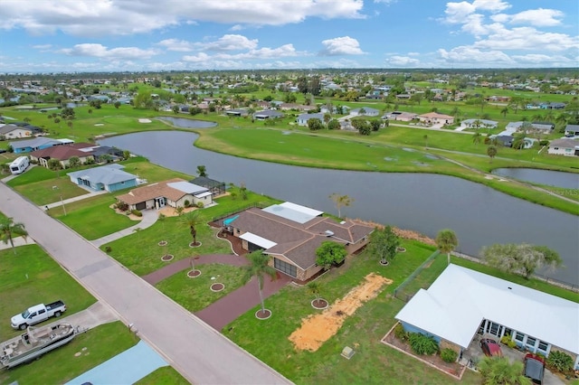 birds eye view of property featuring golf course view, a water view, and a residential view