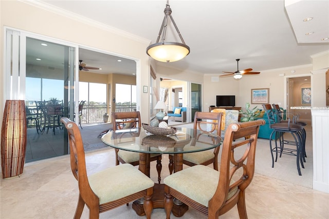 tiled dining room with ornamental molding and ceiling fan