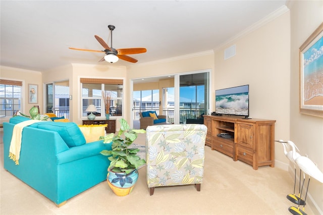 living room featuring light colored carpet, ornamental molding, and ceiling fan