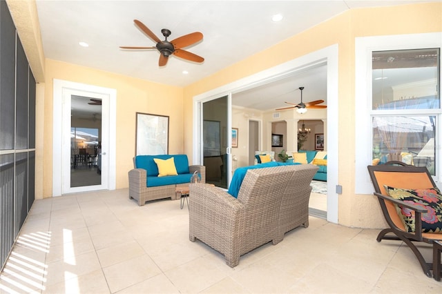 living room with ceiling fan and light tile flooring